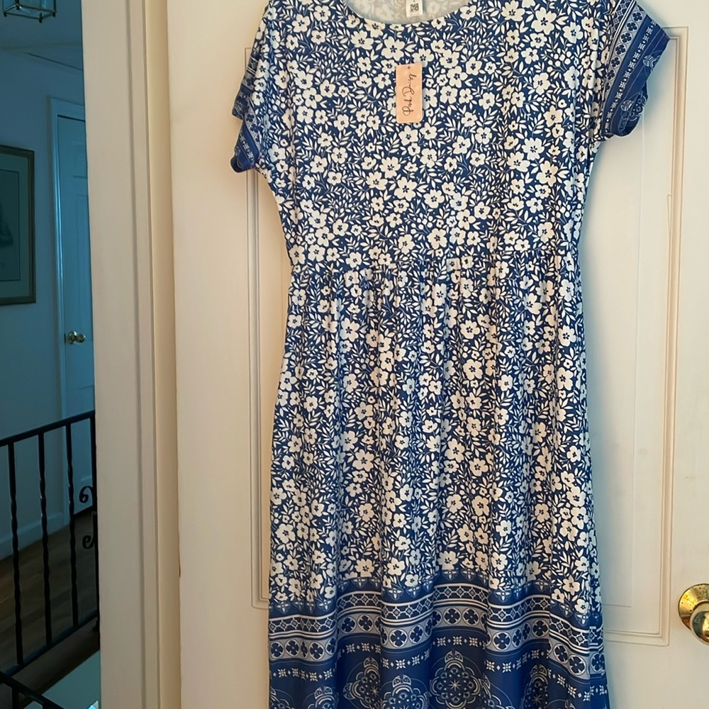New dress, never worn, with tags.. size small but fits more like a medium size..